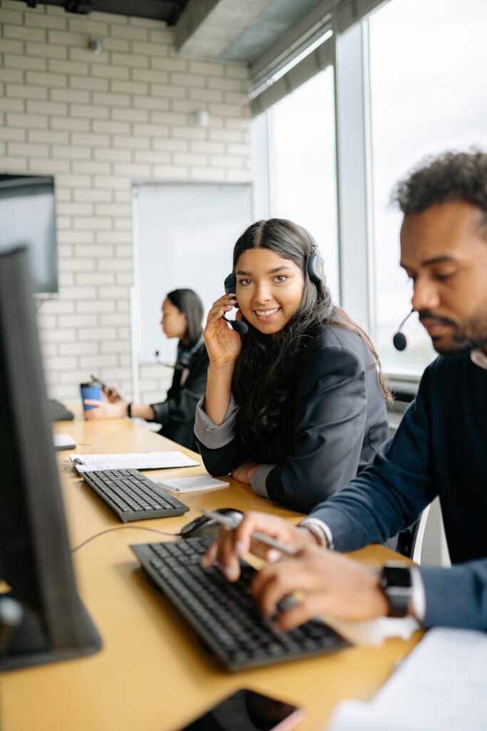 pexels-photo-8867272 Team of diverse call center agents collaborating efficiently in a modern office.